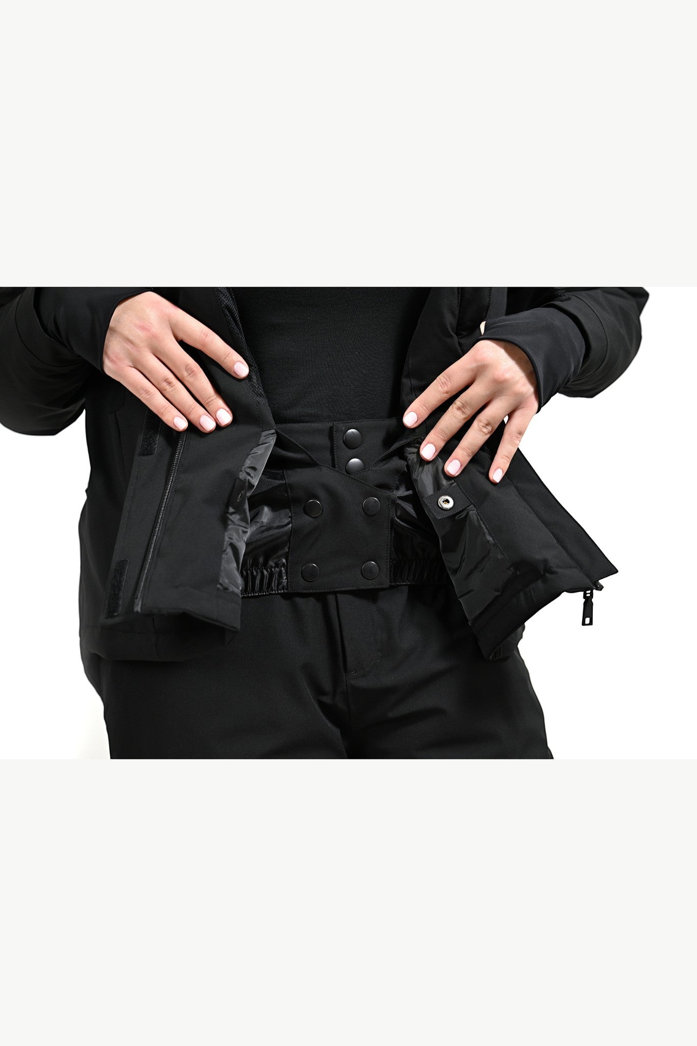 Snow by Clo The Clo Jacket in black featuring a functional internal snow skirt with snap button closure
