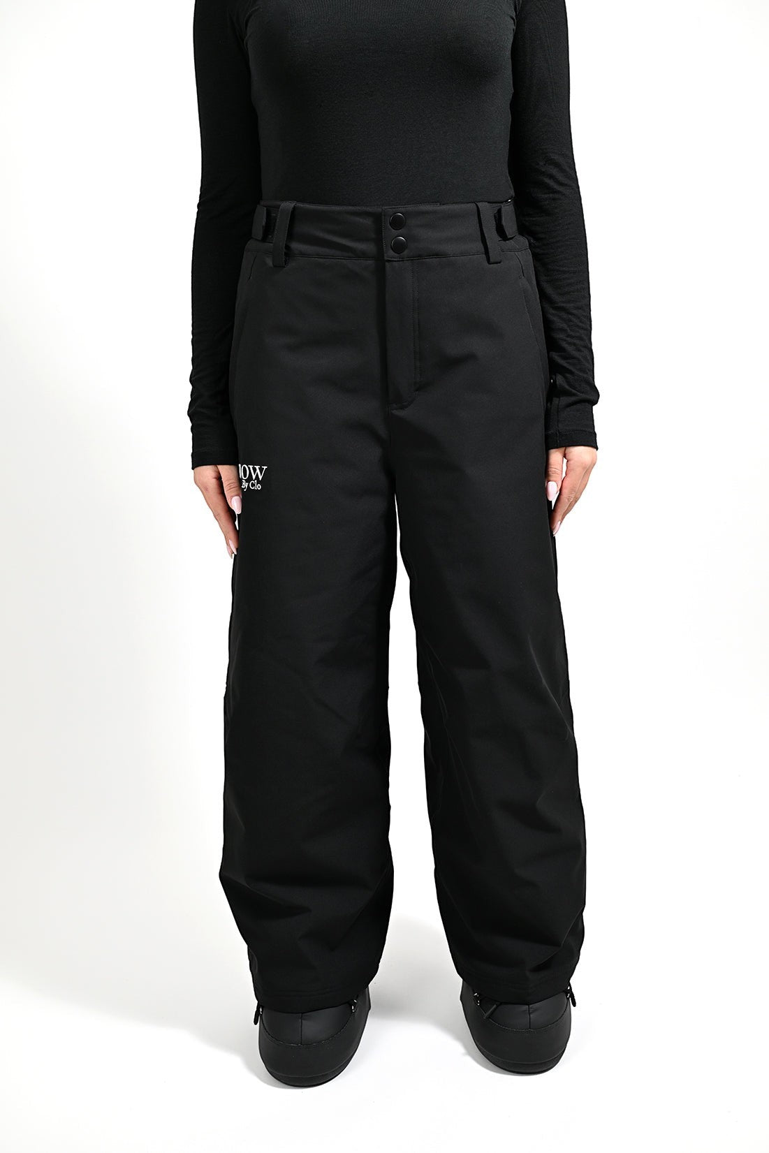 Snow by Clo Jessica petite-friendly black waterproof ski pants with high waist and adjustable fit on a model